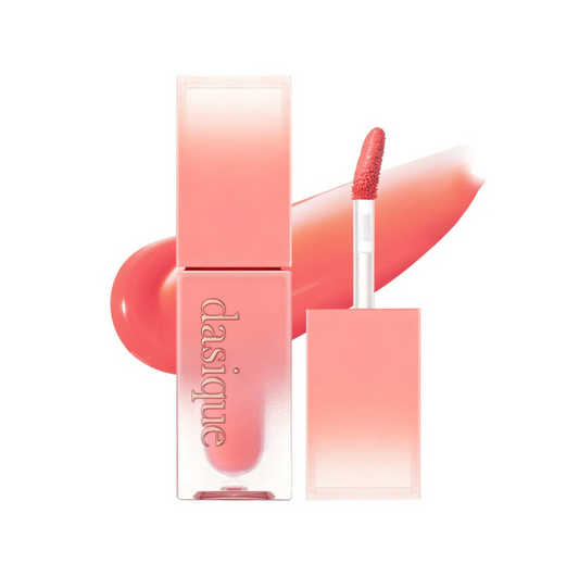 Dasique coral lip gloss with applicator on a white background