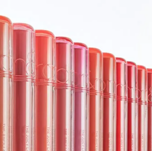 Row of red lipsticks with visible brand name on a white background