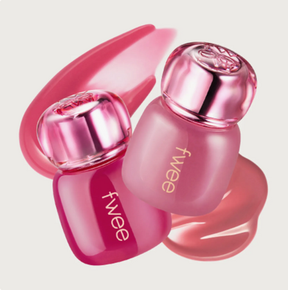 Pink lip tnts with 'fwee' branding on a light pink background