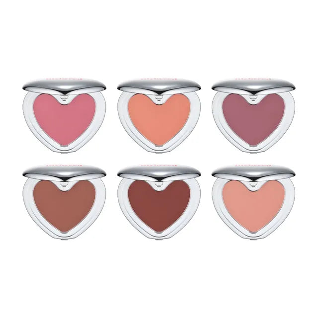 Set of heart-shaped blushes in various shades on a white background
