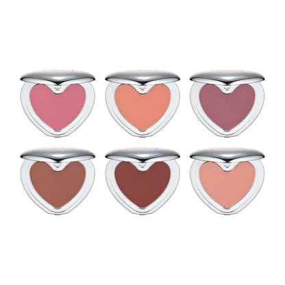 Set of heart-shaped blushes in various shades on a white background