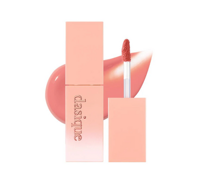 milky pink Lip tint with applicator and packaging on a white background