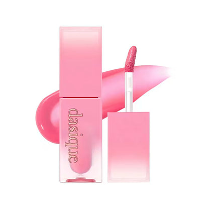 Pink lip product with applicator and packaging on a white background