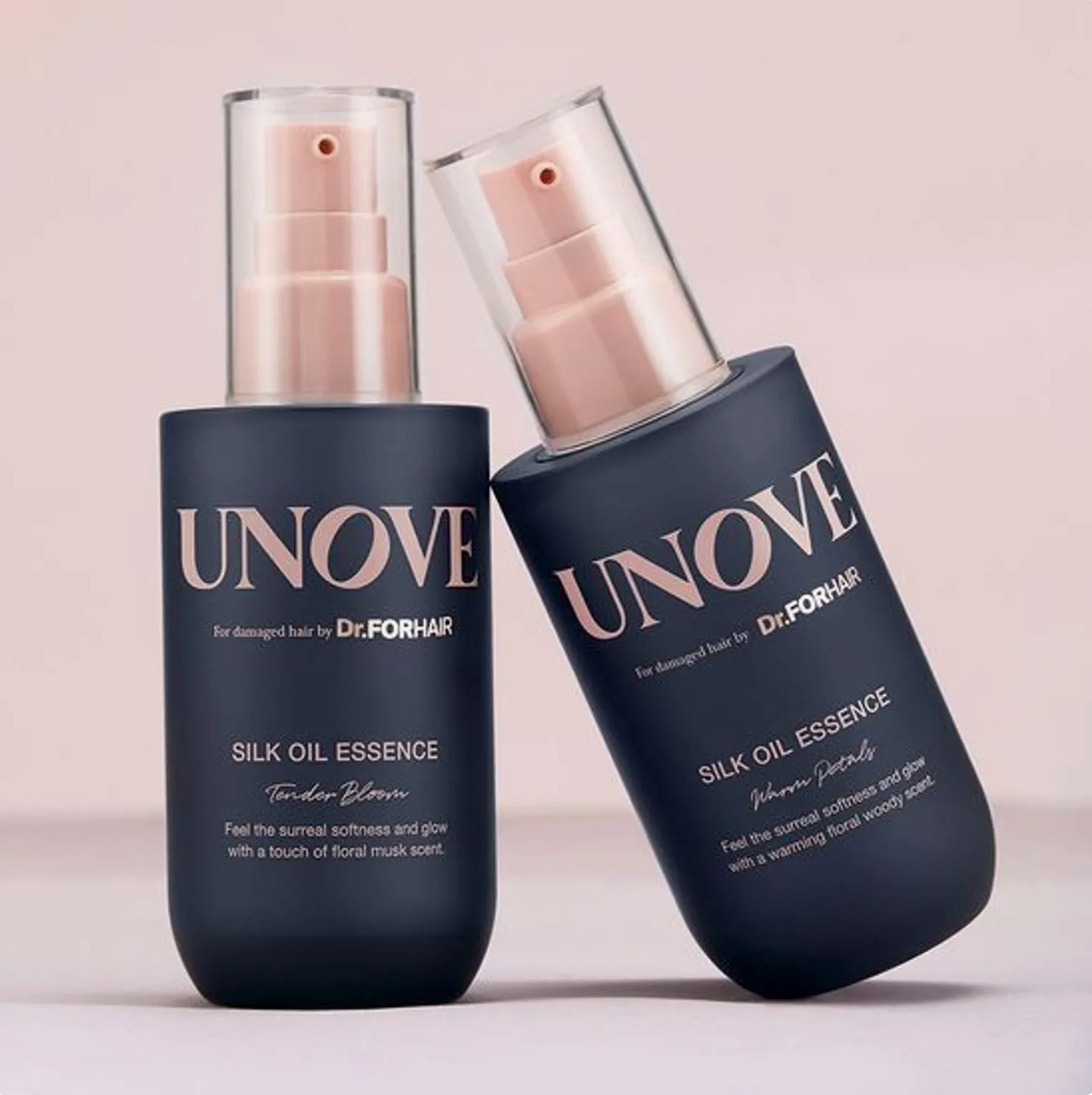 Two bottles of UNOVE Silk Oil Essence on a light pink background