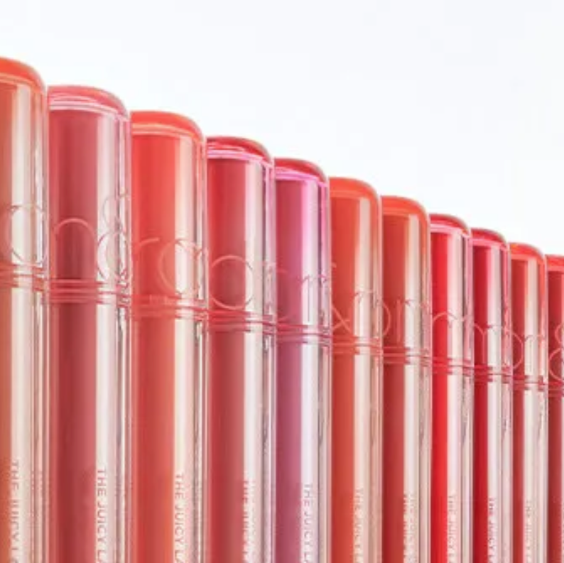 Row of red lipsticks with visible brand name on a white background