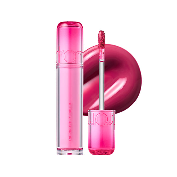 Pink lip gloss with applicator on a white background