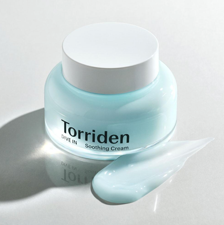Torriden Soothing Cream jar with a smear of cream on a light gray background